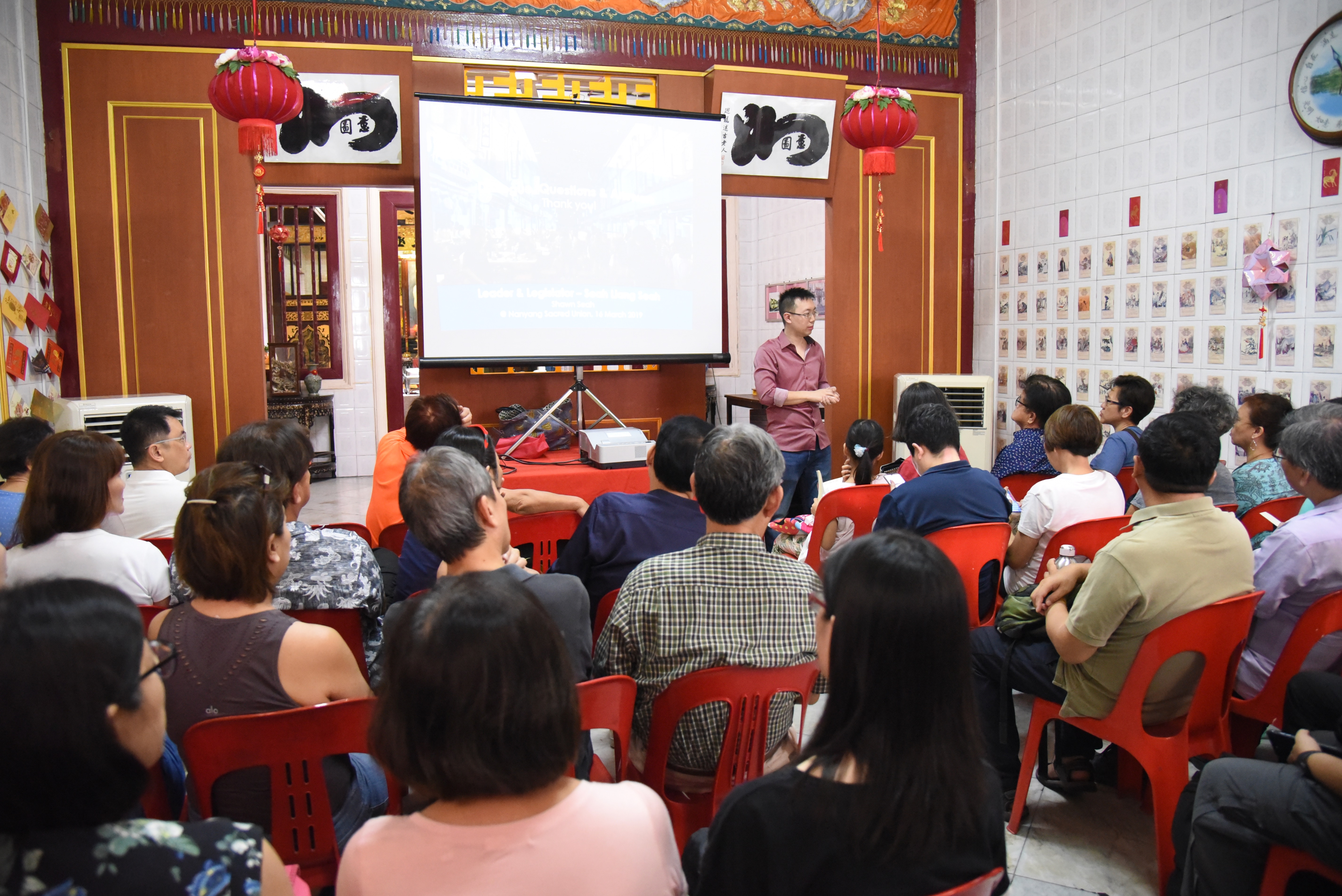 Author and speaker Shawn Seah listening to a question by an audience member, at the Nanyang Sacred Union, a Chinese temple in Singapore. 