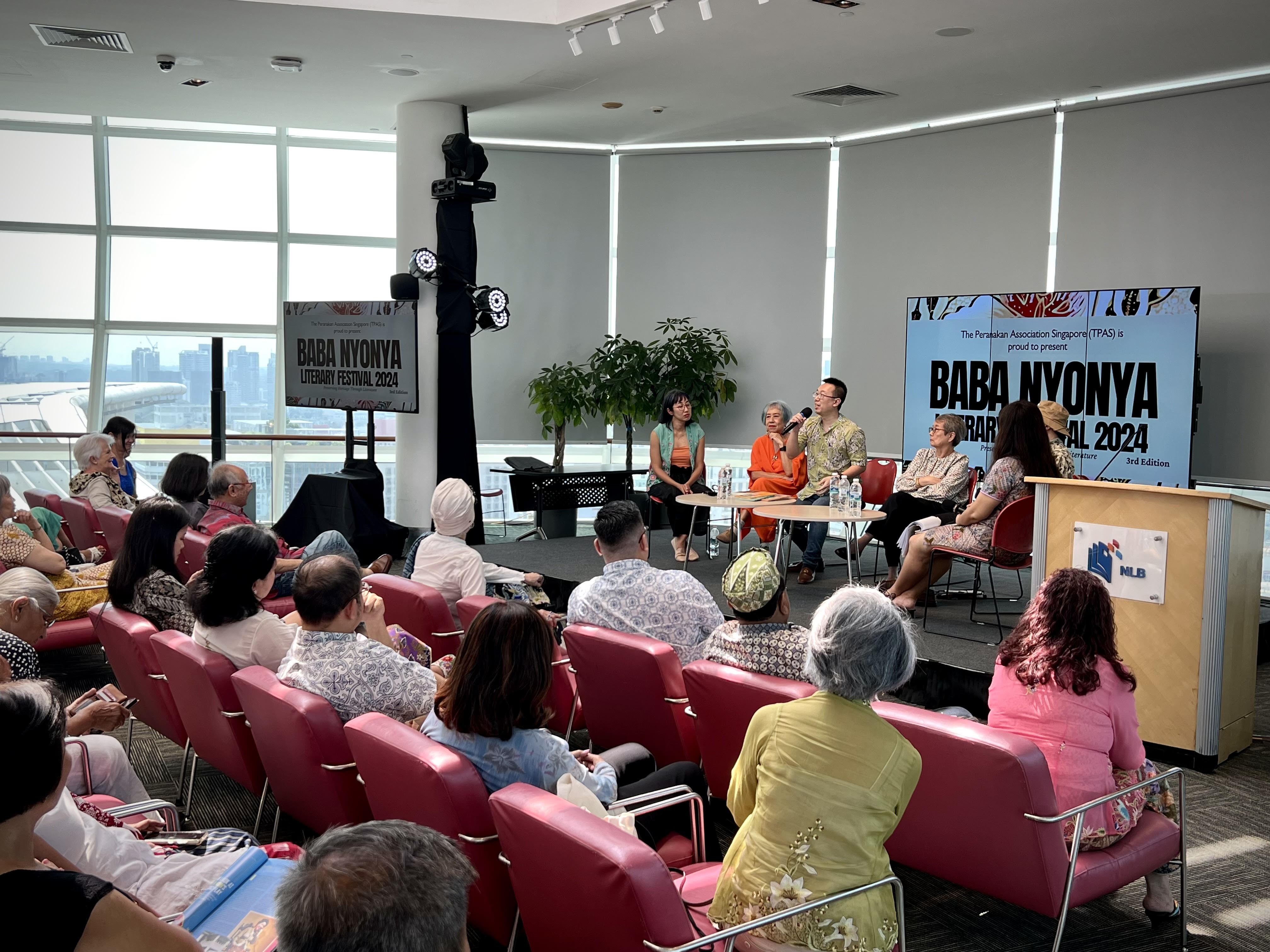 Published author and public speaker Shawn Seah speaking at a panel discussion at the 2024 Baba Nyonya Literary Festival. 
