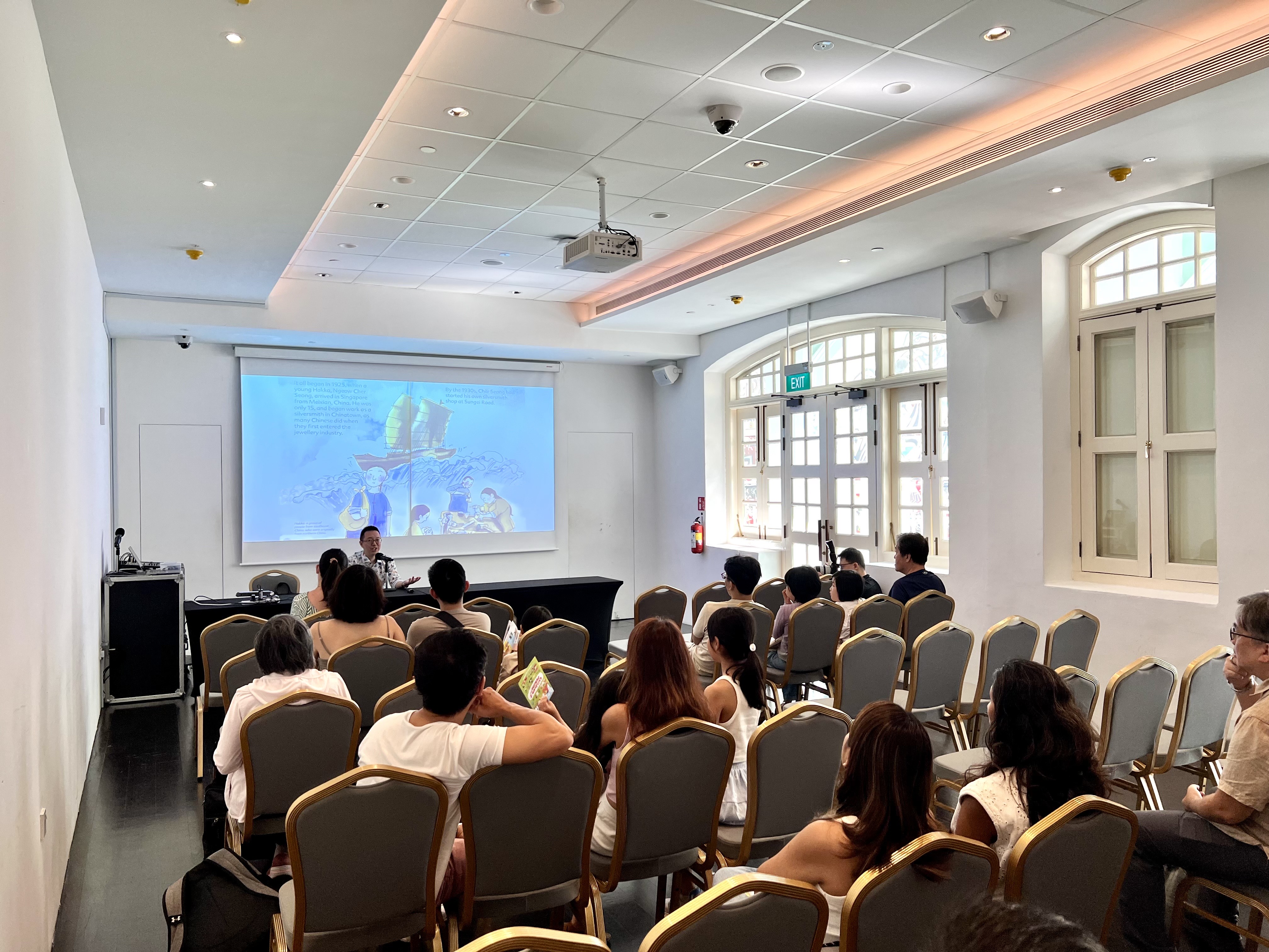 Author and speaker Shawn Seah telling historical stories at the Peranakan Museum.