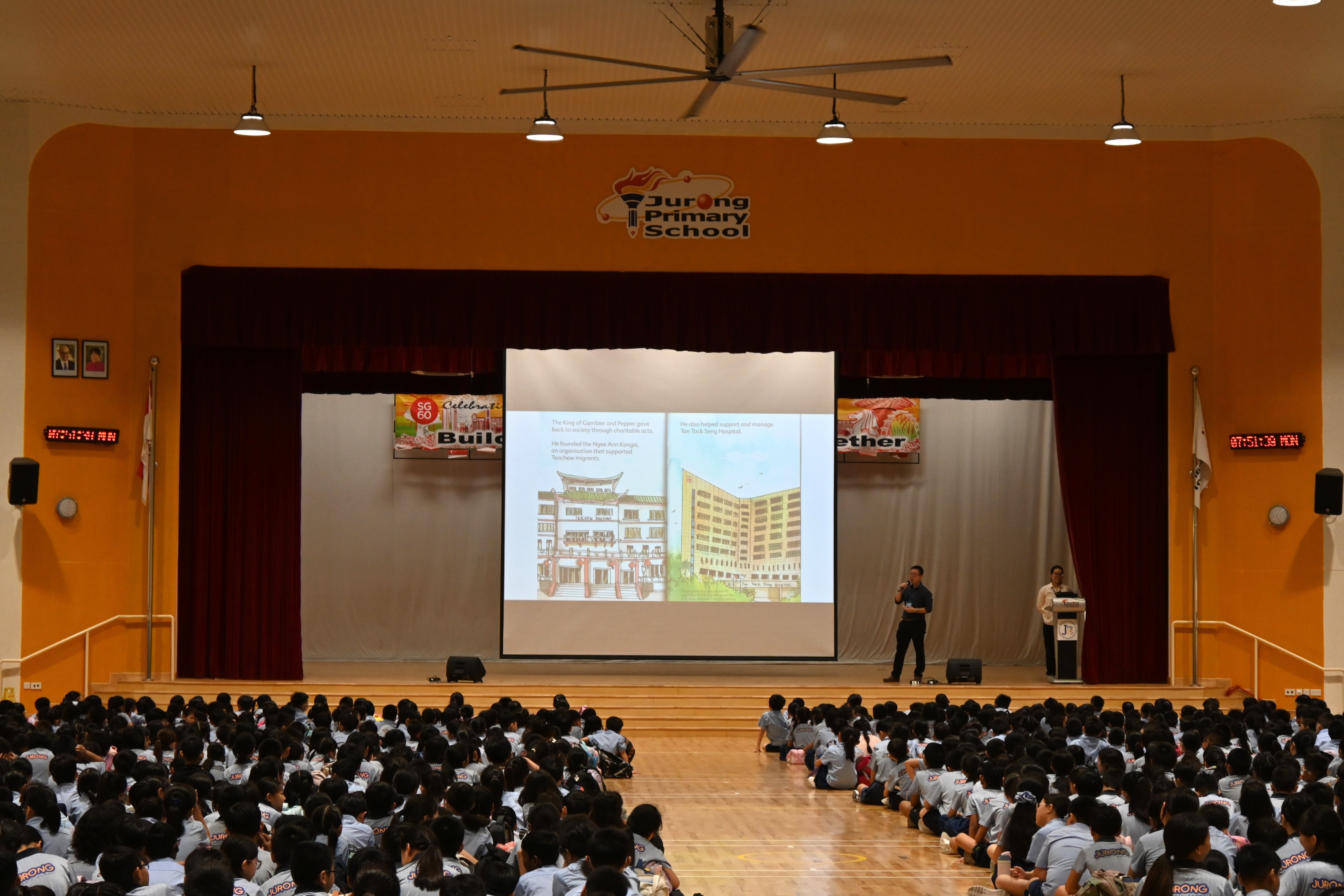 Author Shawn Seah speaking at a morning assembly talk to hundreds of primary school students. 