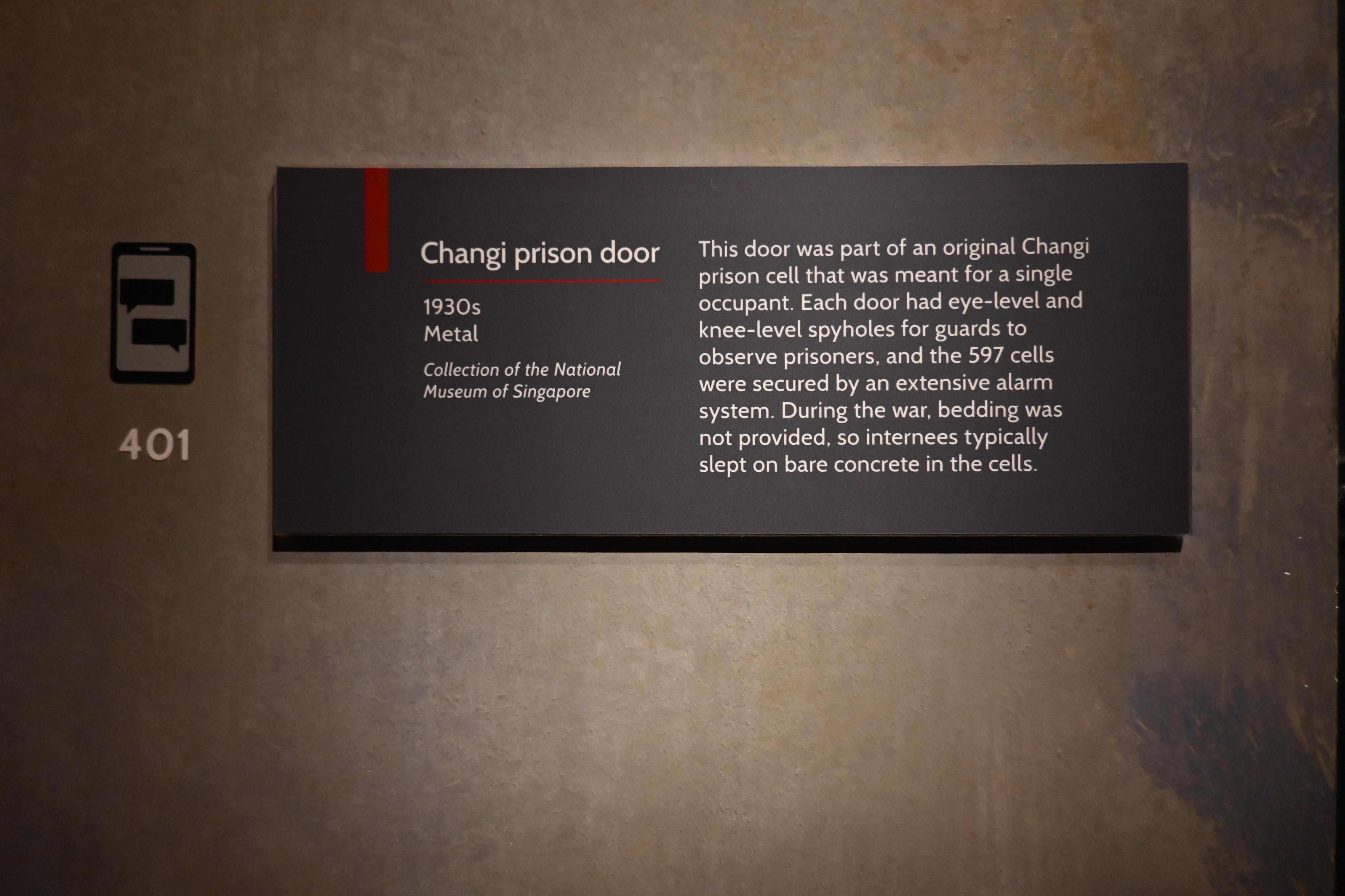 Museum label about the Changi prison door at Changi Chapel and Museum. 